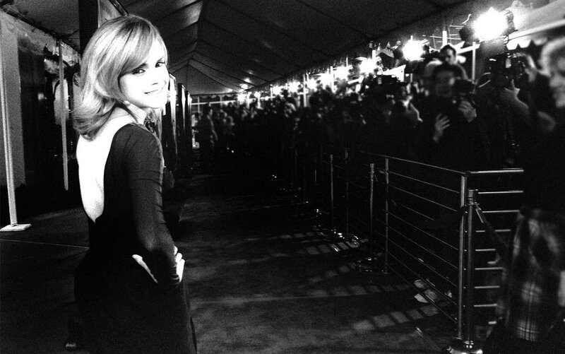 woman on red carpet smiling