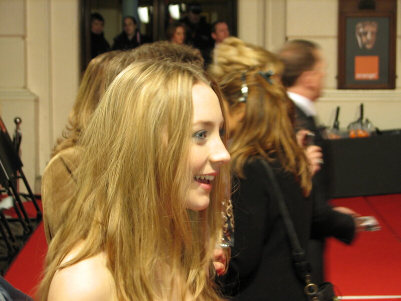 woman on red carpet smiling