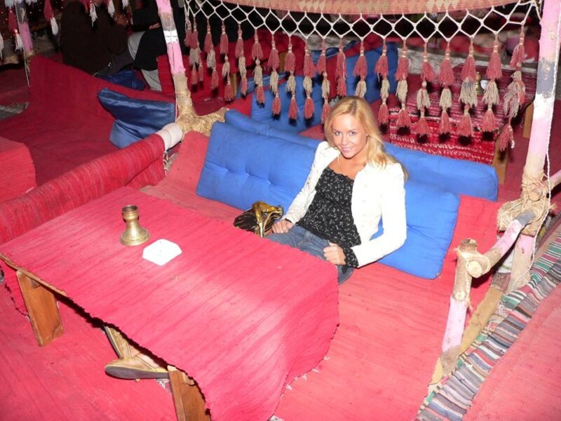 Woman on Red Couch — Relaxed, Photograph, Pillows, Tassels