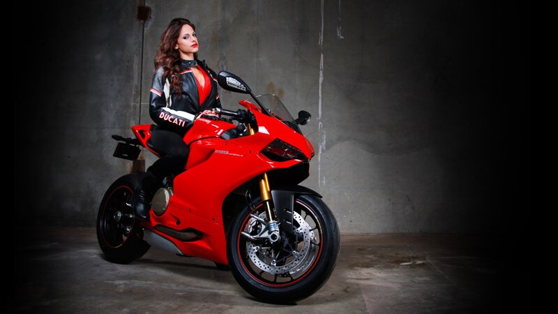 Woman on red Ducati motorcycle