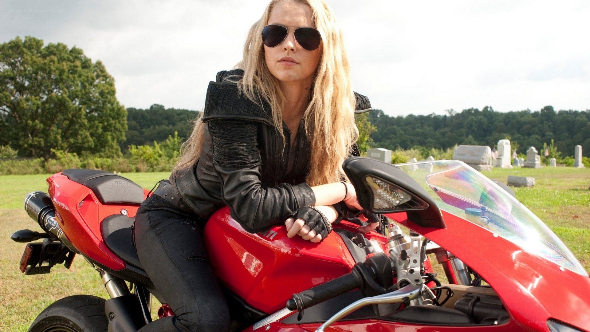 Woman on red motorcycle