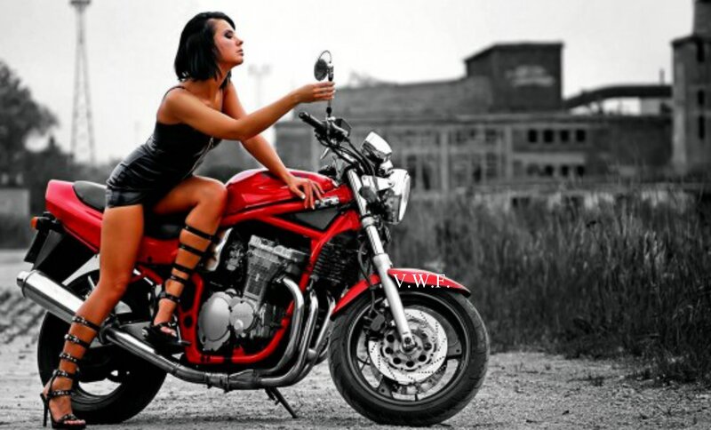 Woman on Red Motorcycle — Dramatic, Photograph, Building