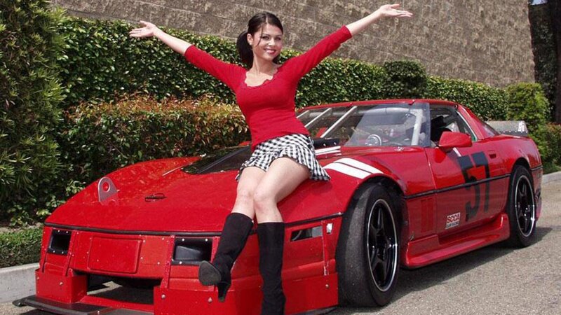 Woman on Red Race Car
