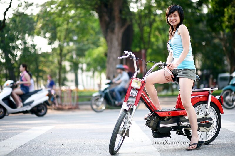 Woman on red scooter