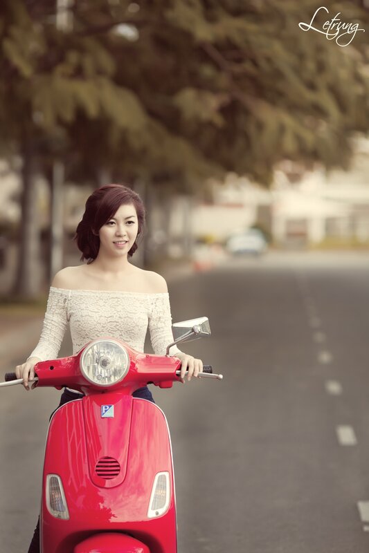 woman on red scooter