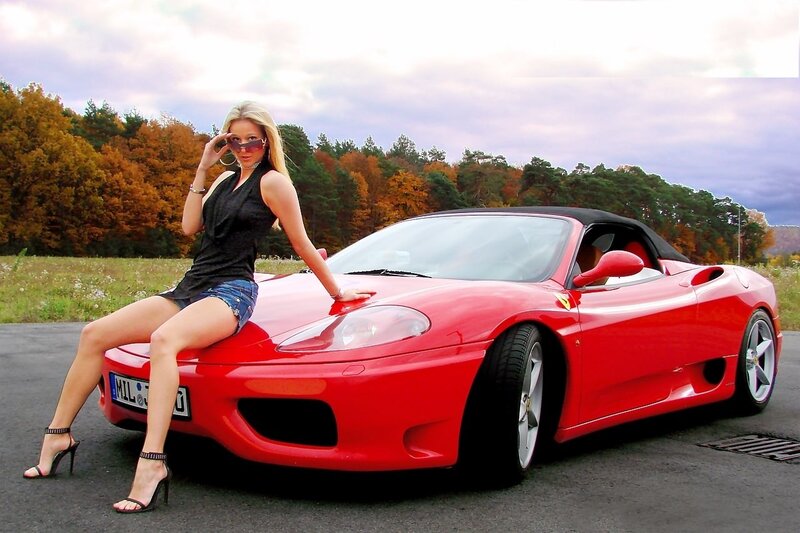 Woman on Red Sports Car — Dramatic