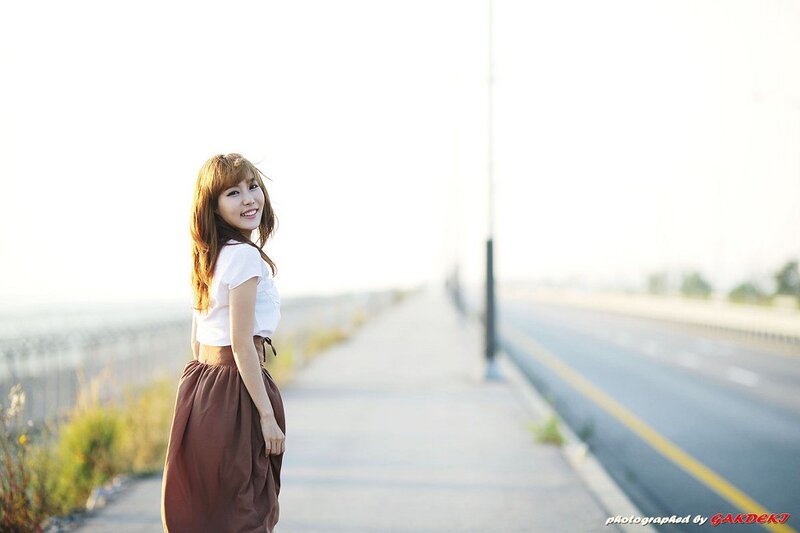 Woman on Roadside — White, Serene