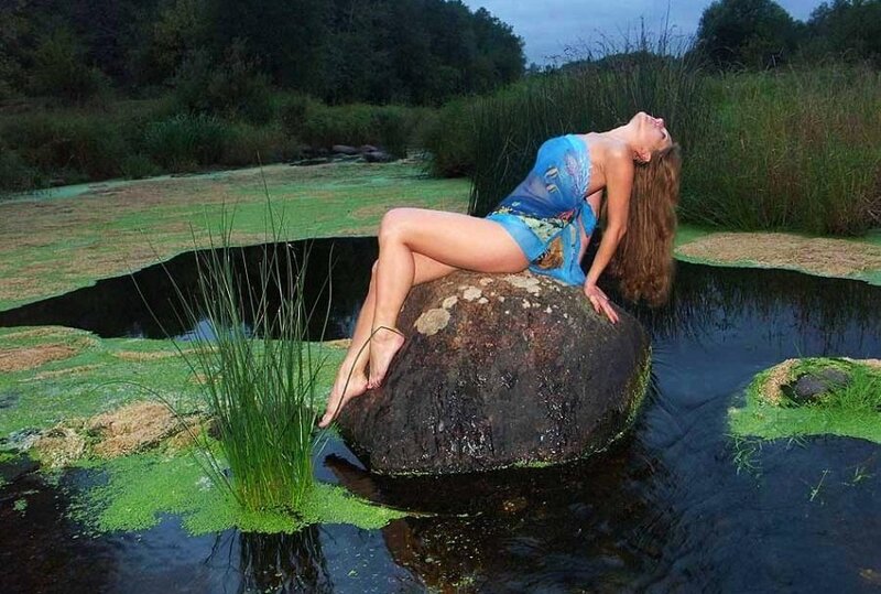 Woman on Rock in Pond