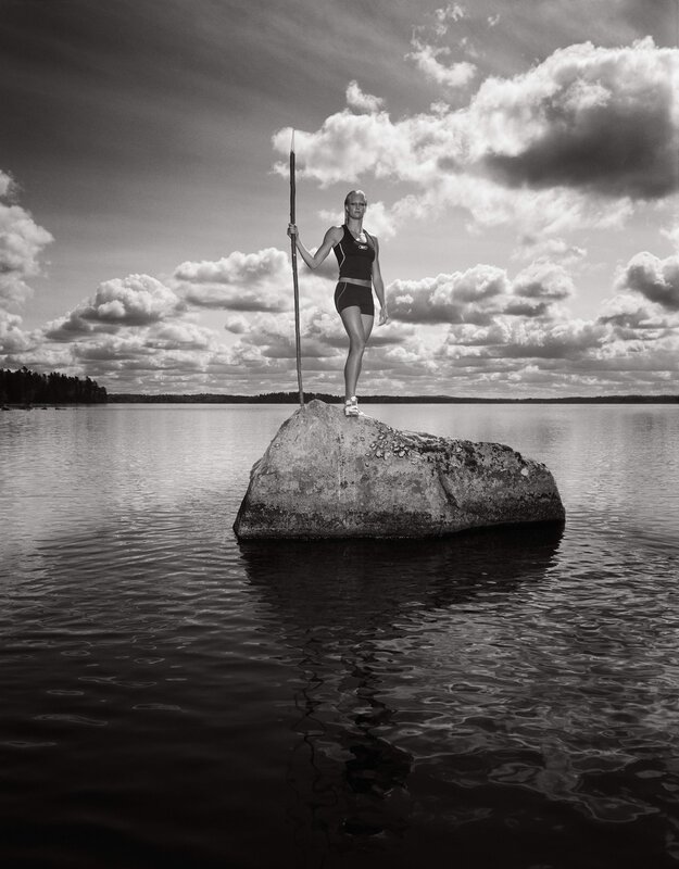 Woman on rock with spear
