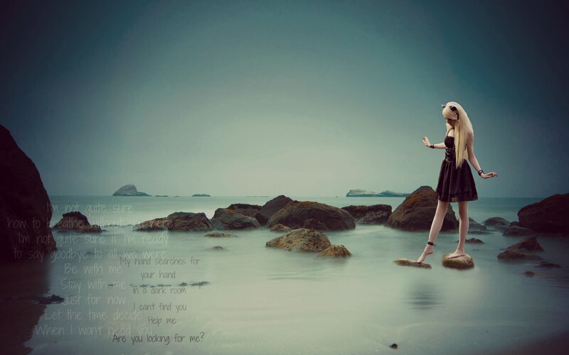 woman on rocks by the sea