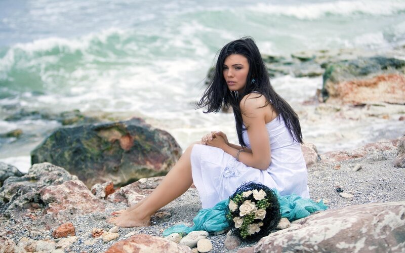 Woman on rocky beach
