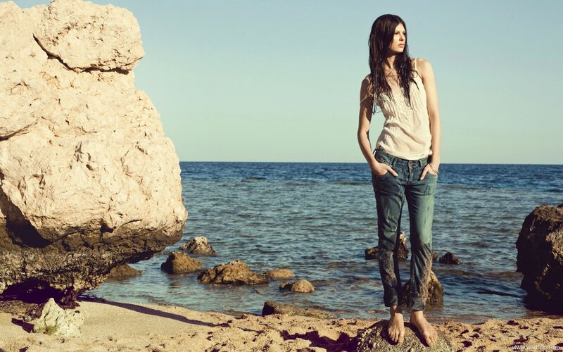 Woman on rocky beach