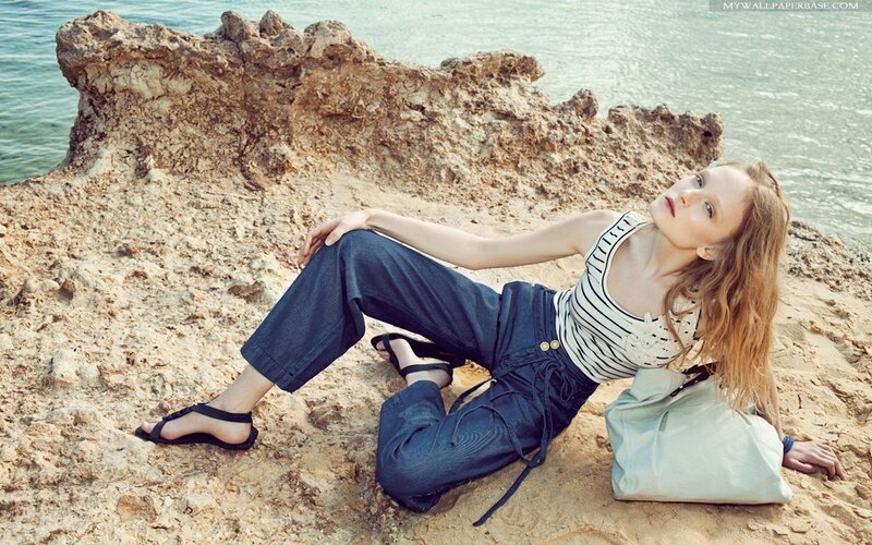 Woman on rocky beach