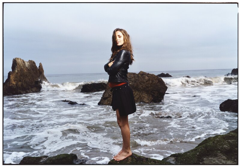 Woman on rocky beach