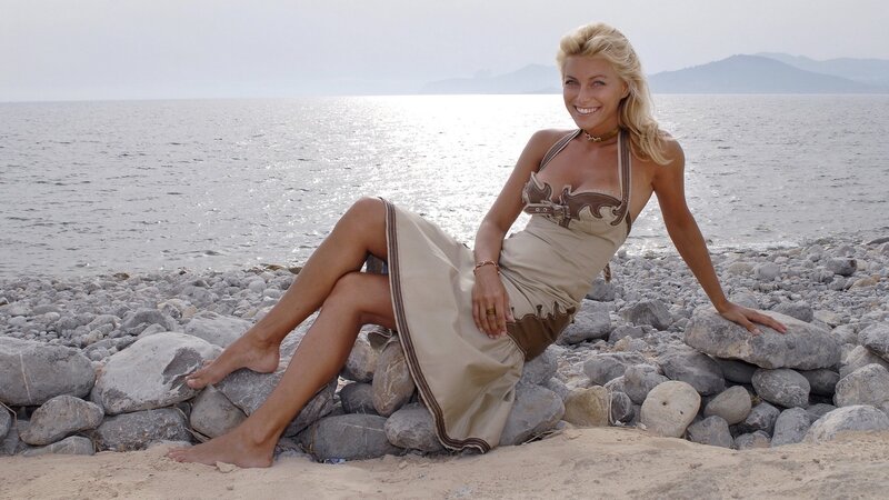 Woman on rocky beach
