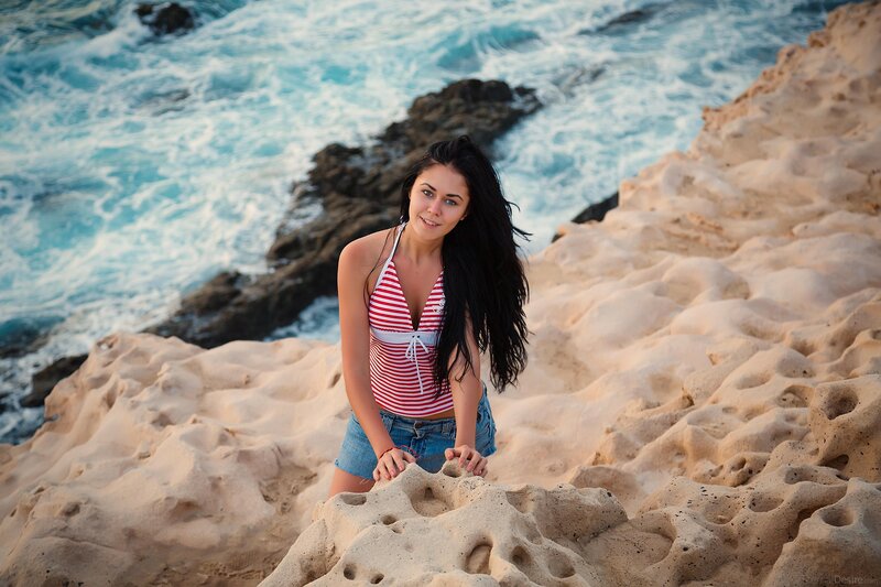 Woman on rocky beach