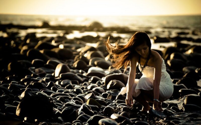 Woman on Rocky Beach — Brown