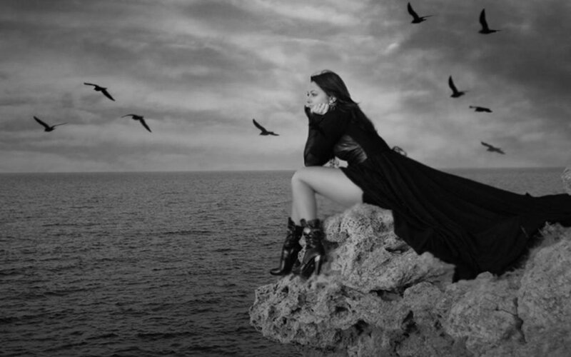 Woman on Rocky Cliff — Black, Dramatic