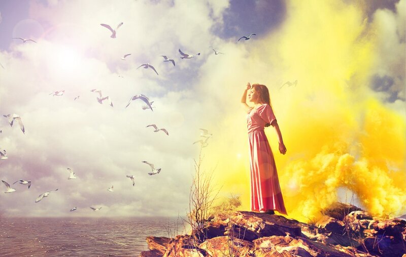 Woman on Rocky Cliff — Yellow