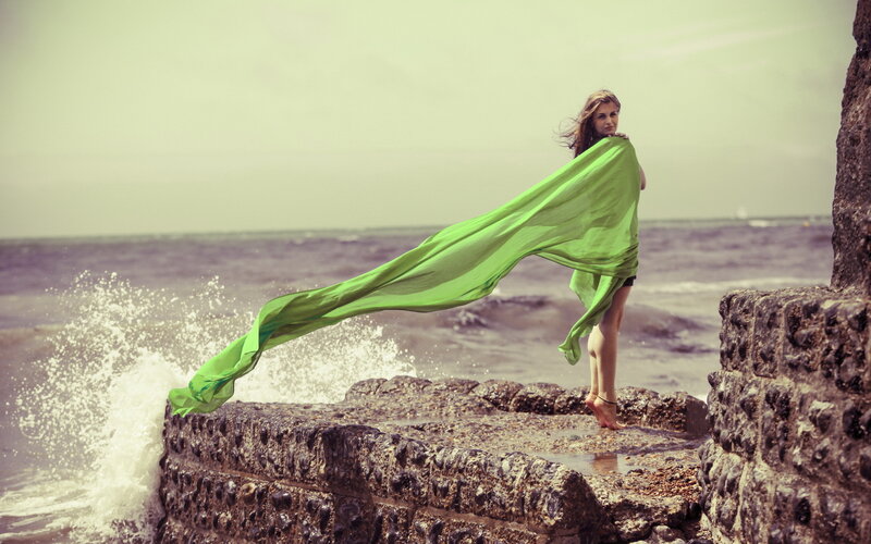 Woman on Rocky Pier