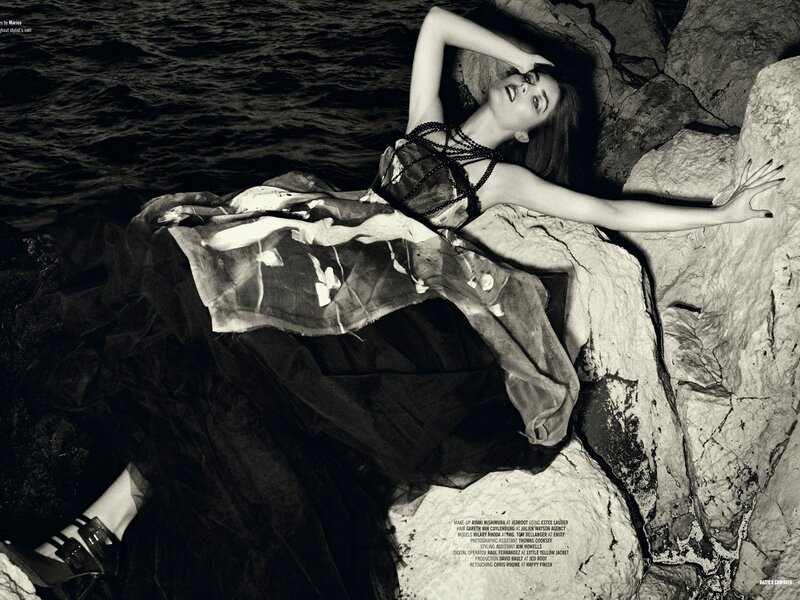 woman on rocky shore