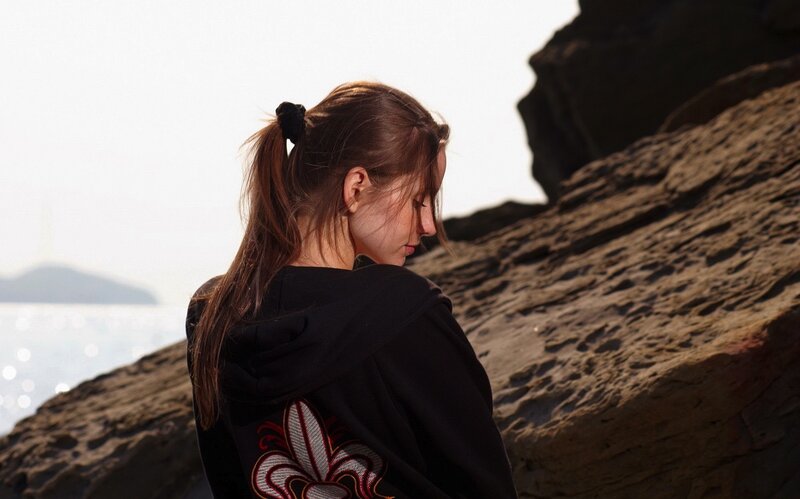 woman on rocky shore