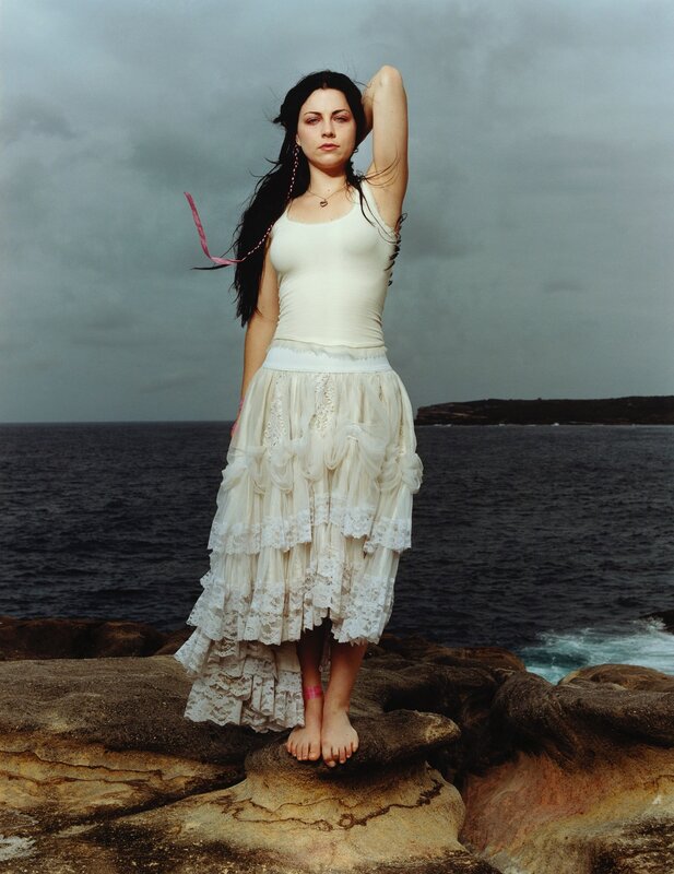Woman on rocky shore