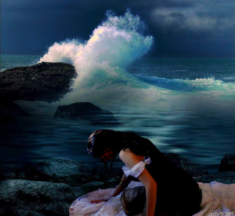 Woman on rocky shore at night