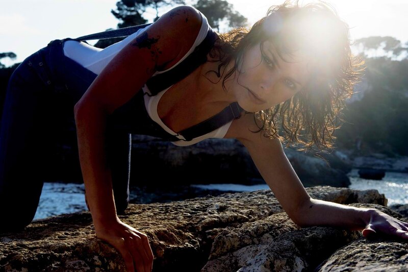 Woman on Rocky Shore — Brown, Dramatic, Afternoon, Photograph, Rocks
