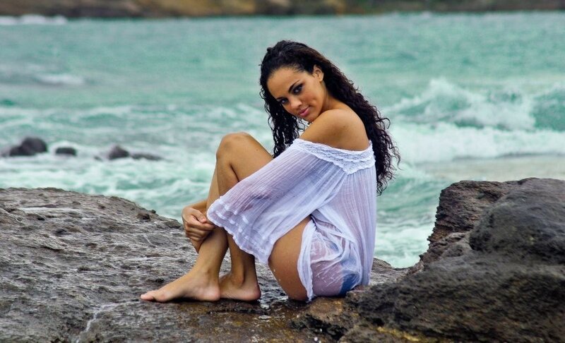 Woman on Rocky Shore — White, Calm, Photograph
