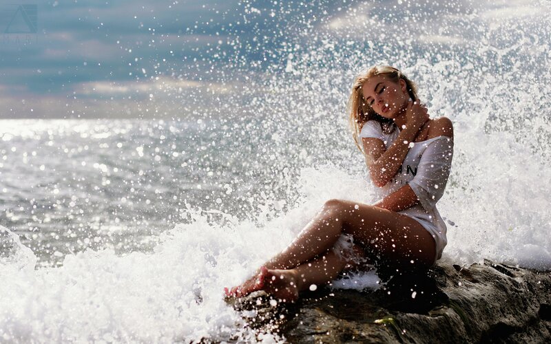 Woman on Rocky Shore — White, Dramatic, Afternoon