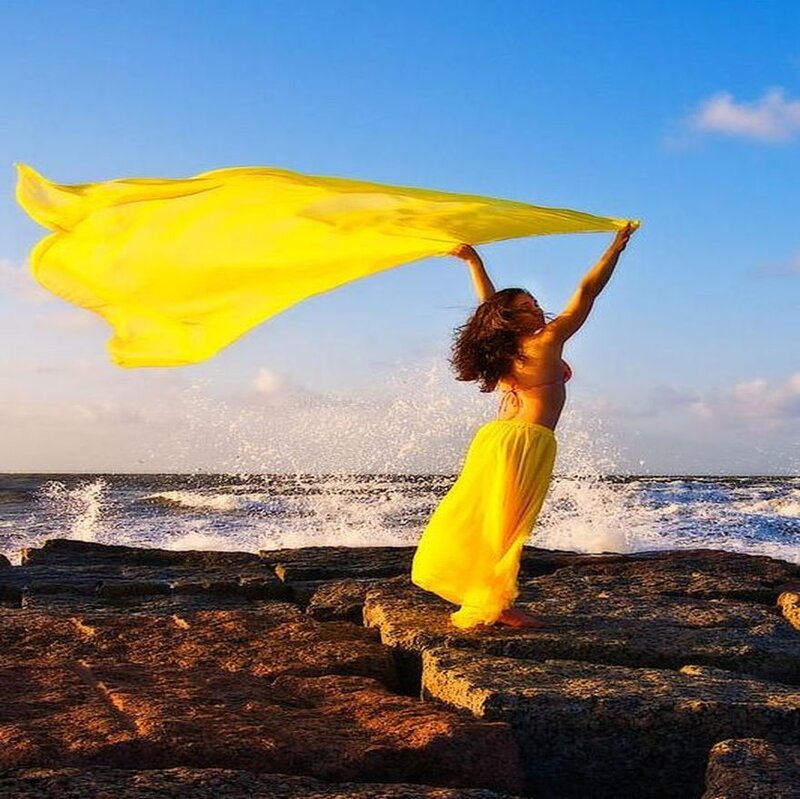 Woman on Rocky Shore — Yellow