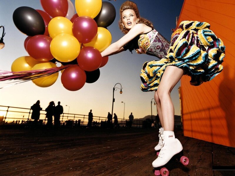 Woman on roller skates with balloons