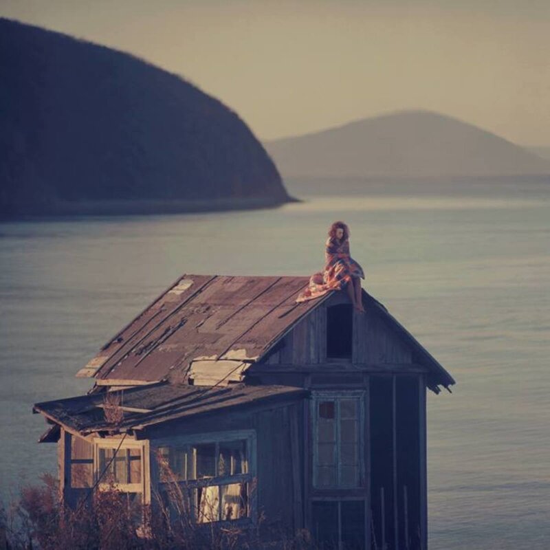 Woman on Roof of Cabin