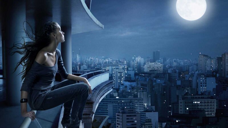 woman on rooftop at night