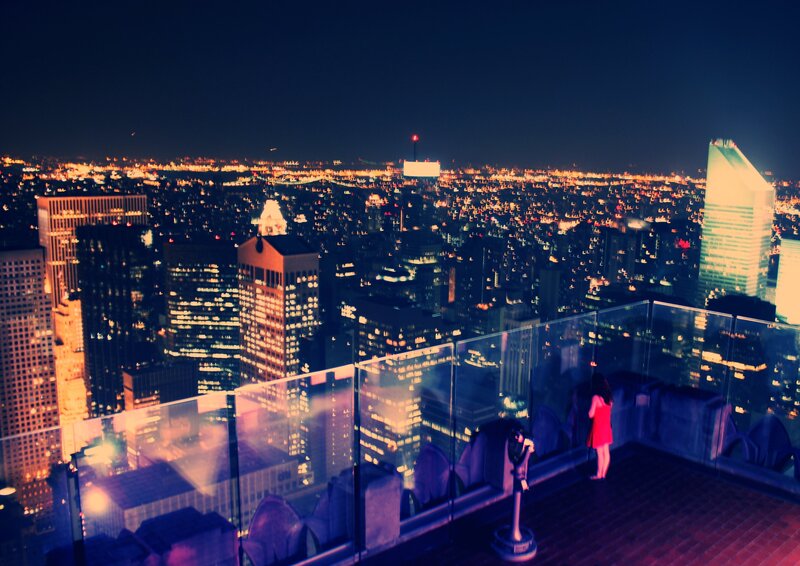 Woman on rooftop at night