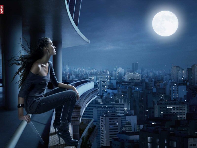 Woman on rooftop at night