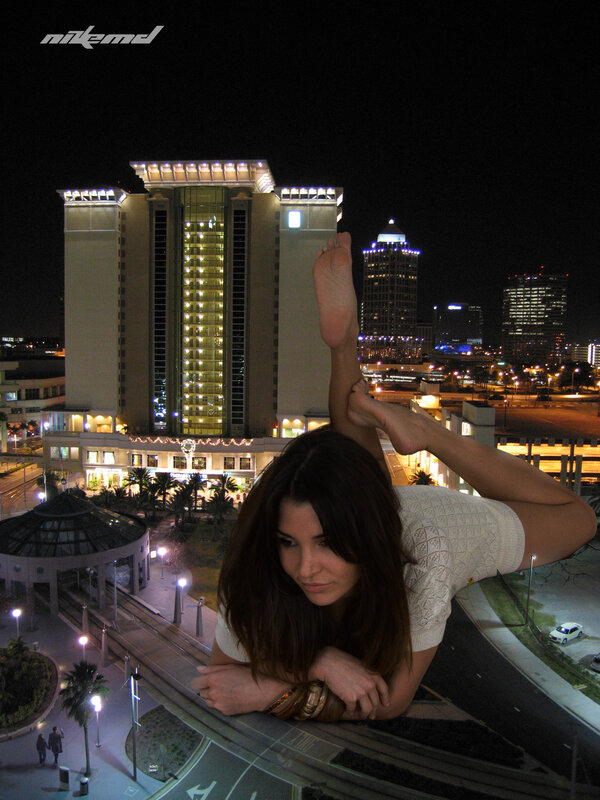 Woman on rooftop at night