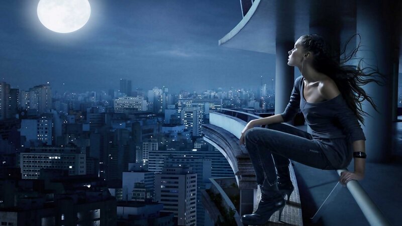 woman on rooftop at night
