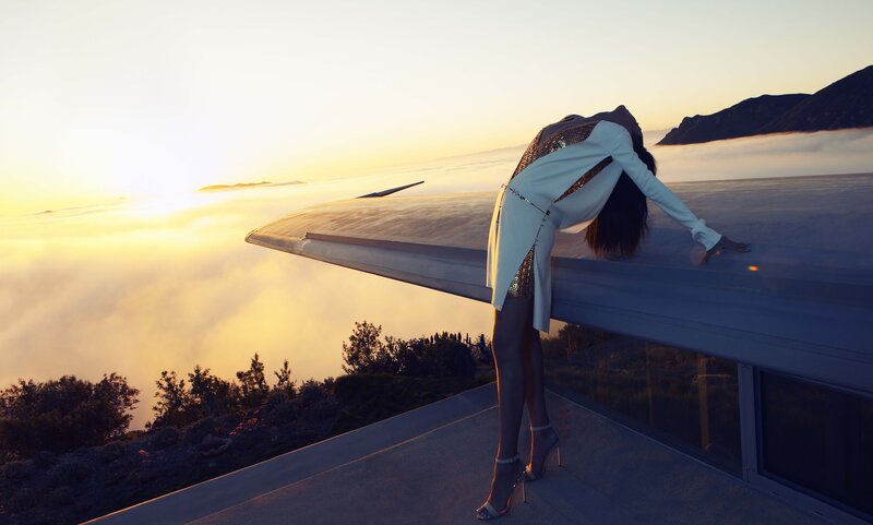 woman on rooftop at sunset