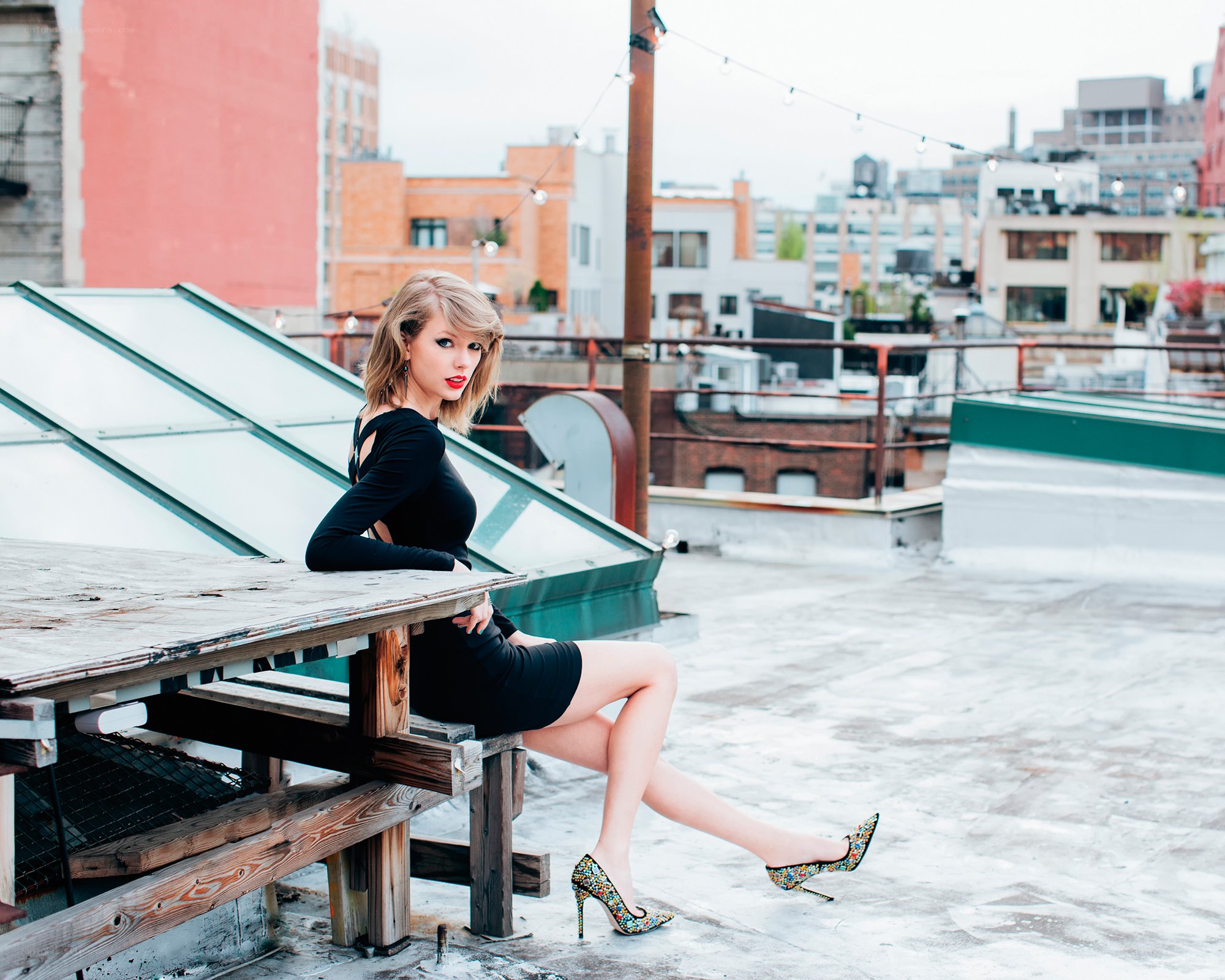 woman on rooftop in city