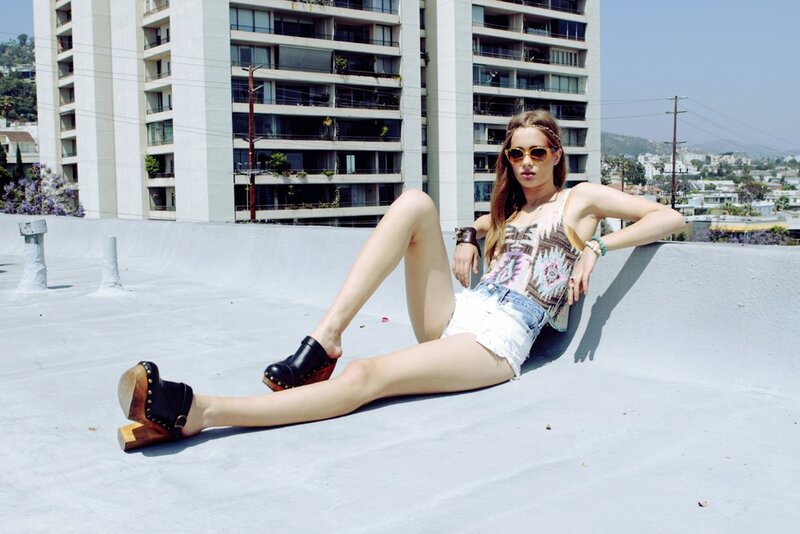 woman on rooftop in summer clothes