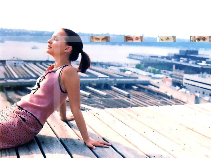 woman on rooftop overlooking city