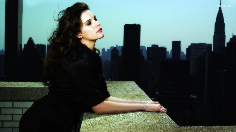 woman on rooftop with city view