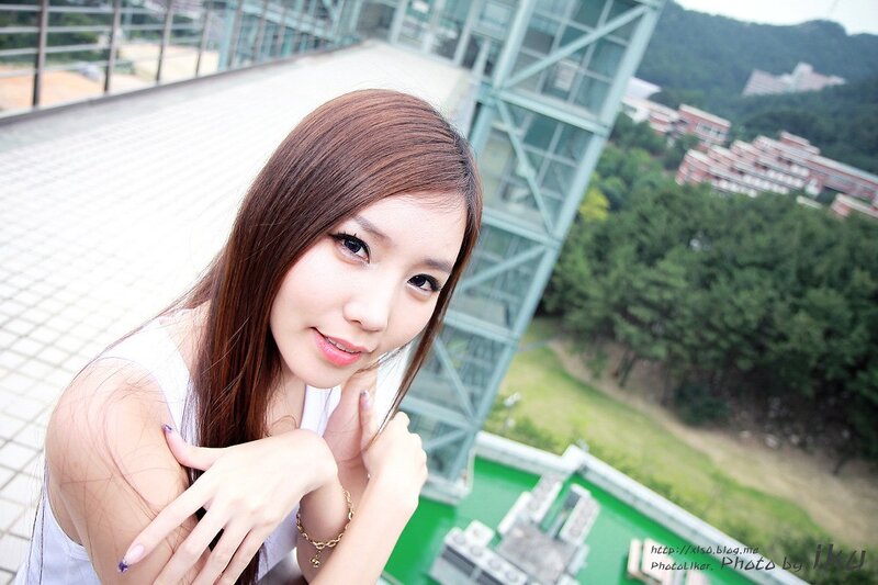 woman on rooftop with city view