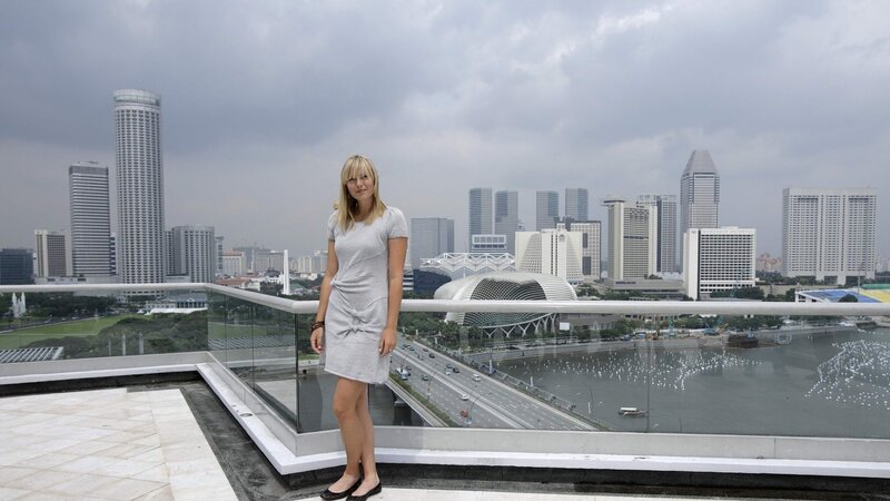 Woman on rooftop with city view