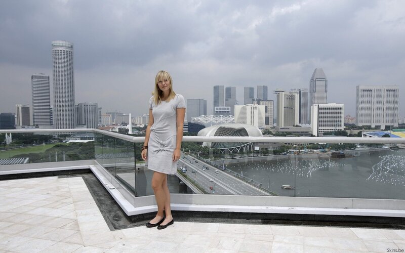 Woman on rooftop with city view