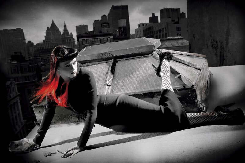 woman on rooftop with red hair