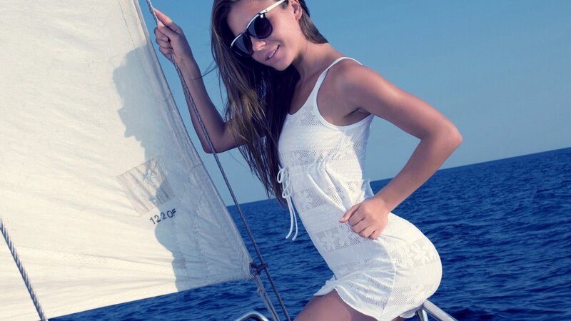 Woman on sailboat at sea