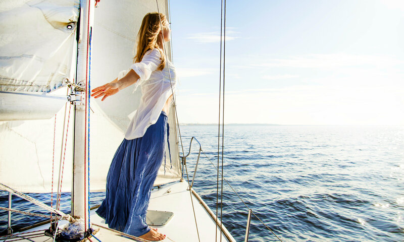 Woman on Sailboat — White, Serene